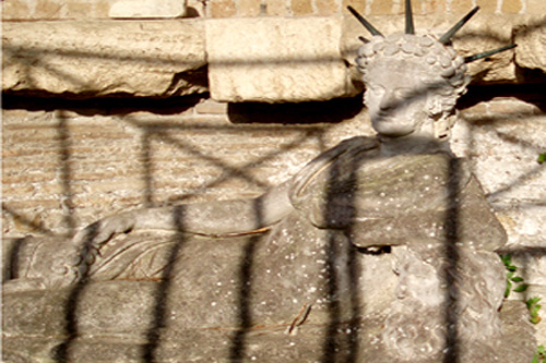 The Great Mother recumbent, using a head as an arm rest, shot in Ostia Antiica, near Rome, by JIm McPherson in 2008